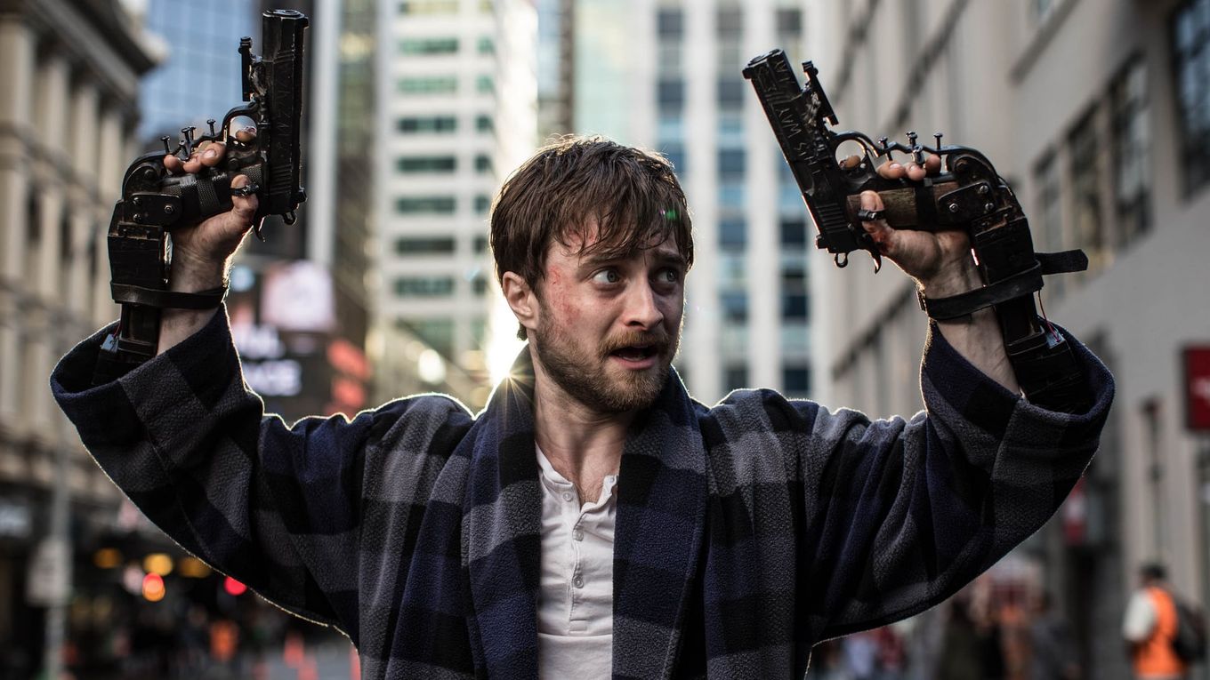 Daniel Radcliffe but he has guns instead of a wand