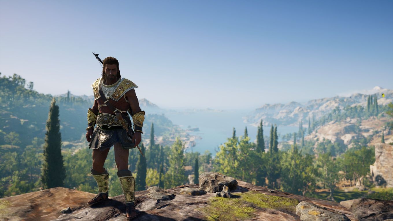 The protagonist standing on top of a mountain next to a forest